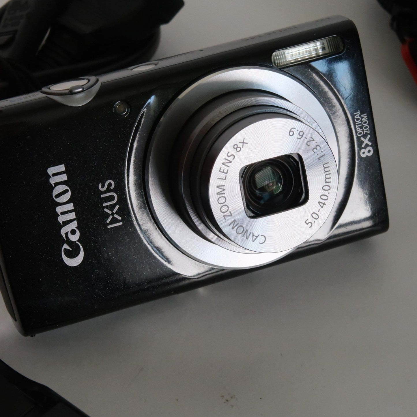 Pre-owned Canon IXUS 145 / ELPH 135 16.0MP Digital Camera Black – With SD Card 4GB & Case
