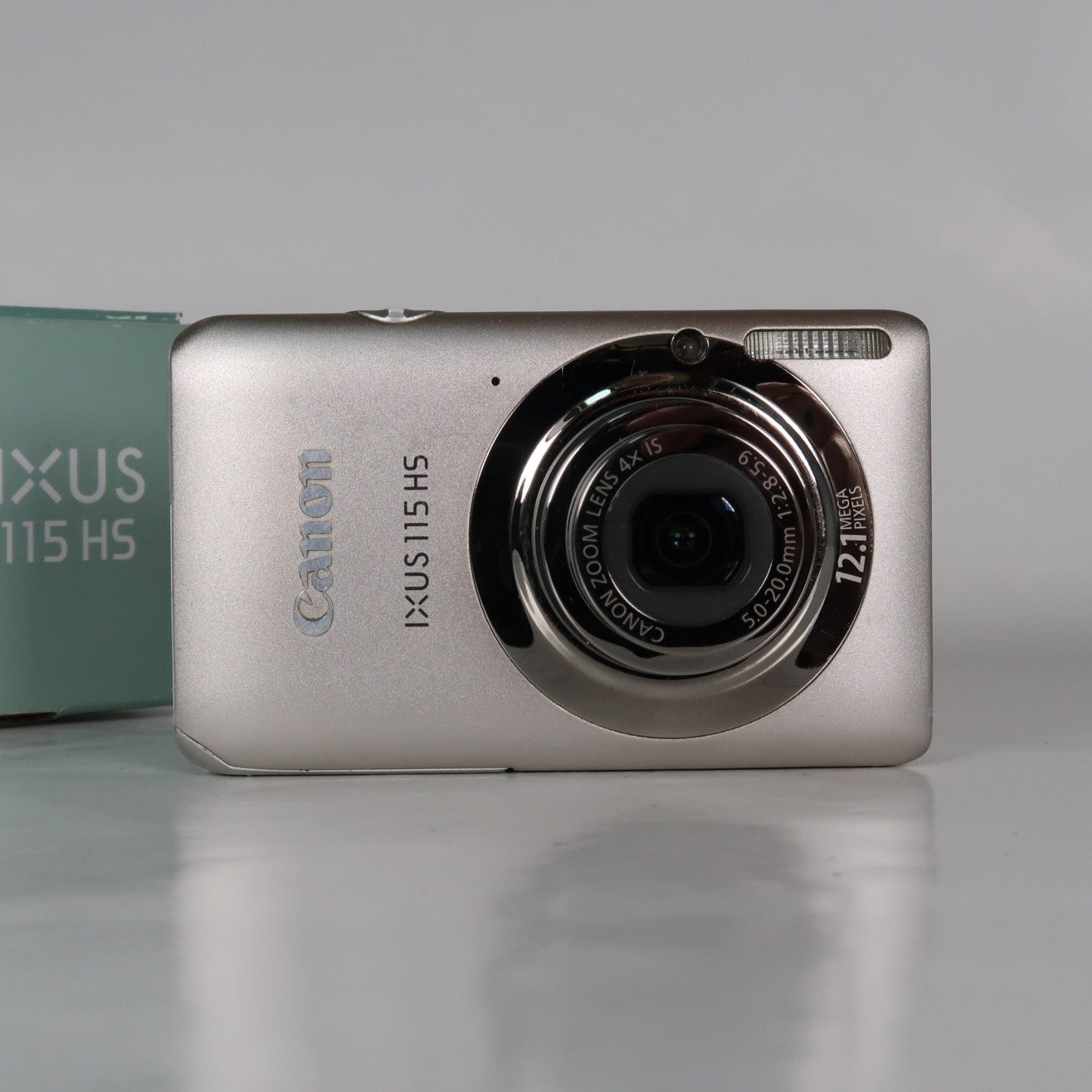 Pre-owned Canon IXUS 115 HS PowerShot ELPH 100 HS 12.1MP 4x Digital Camera Silver – Very Good Condition