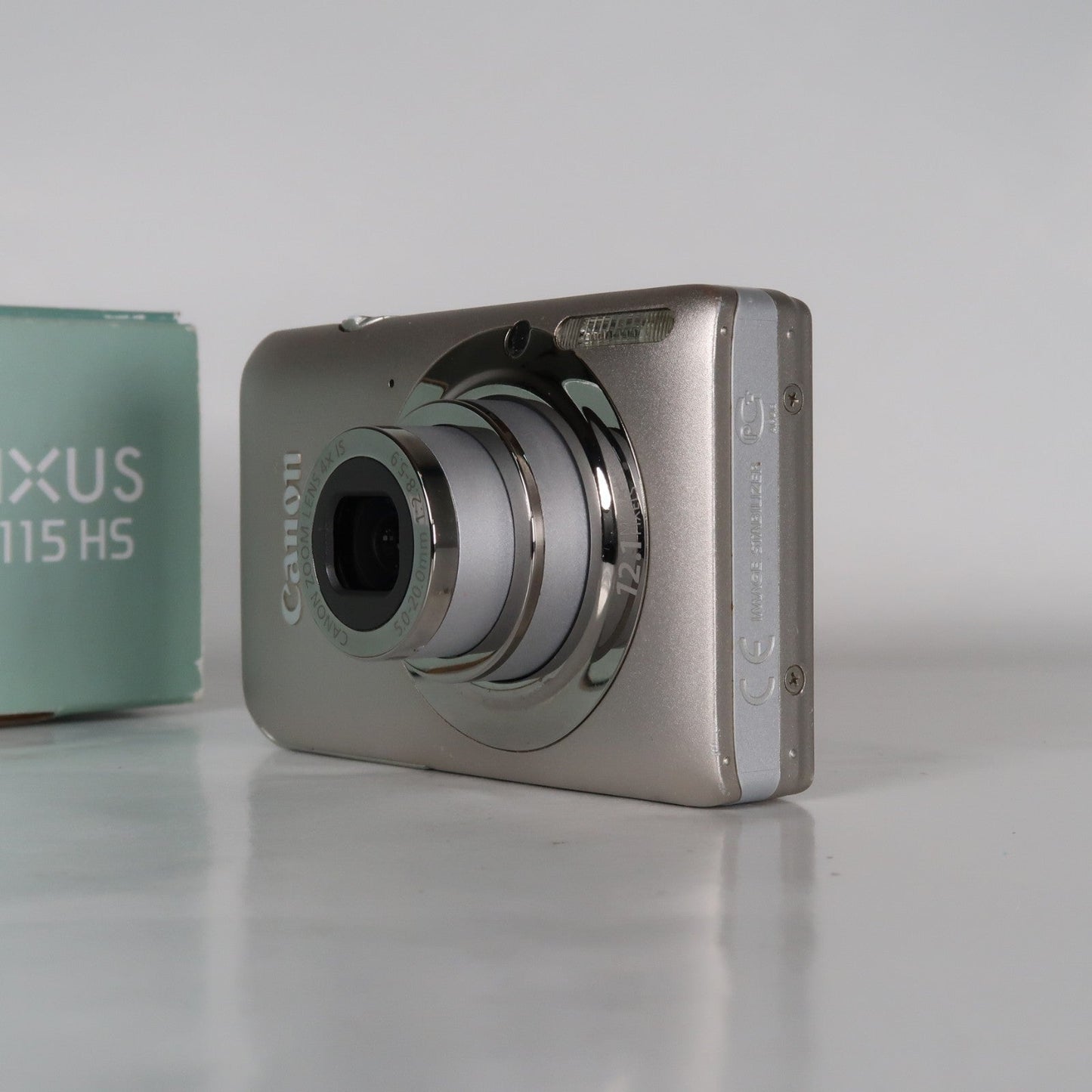 Pre-owned Canon IXUS 115 HS PowerShot ELPH 100 HS 12.1MP 4x Digital Camera Silver – Very Good Condition