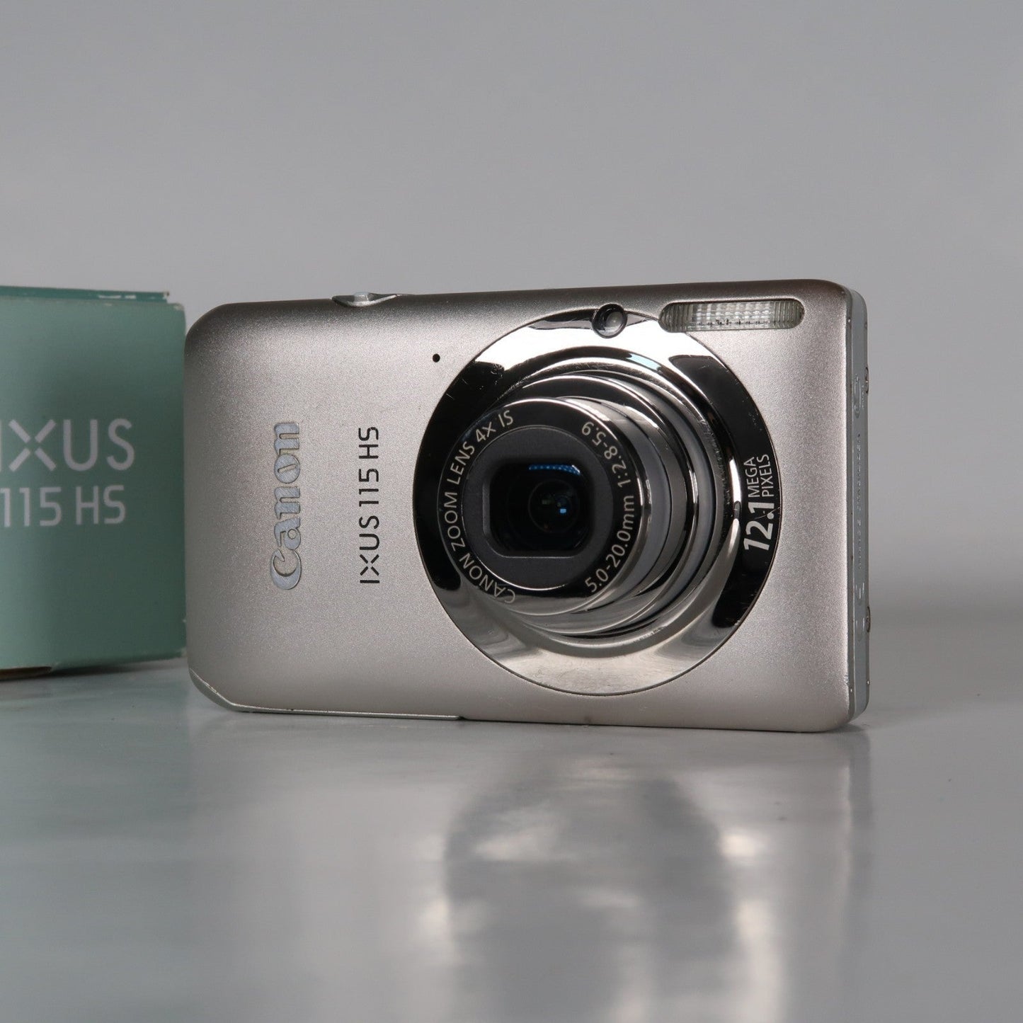 Pre-owned Canon IXUS 115 HS PowerShot ELPH 100 HS 12.1MP 4x Digital Camera Silver – Very Good Condition