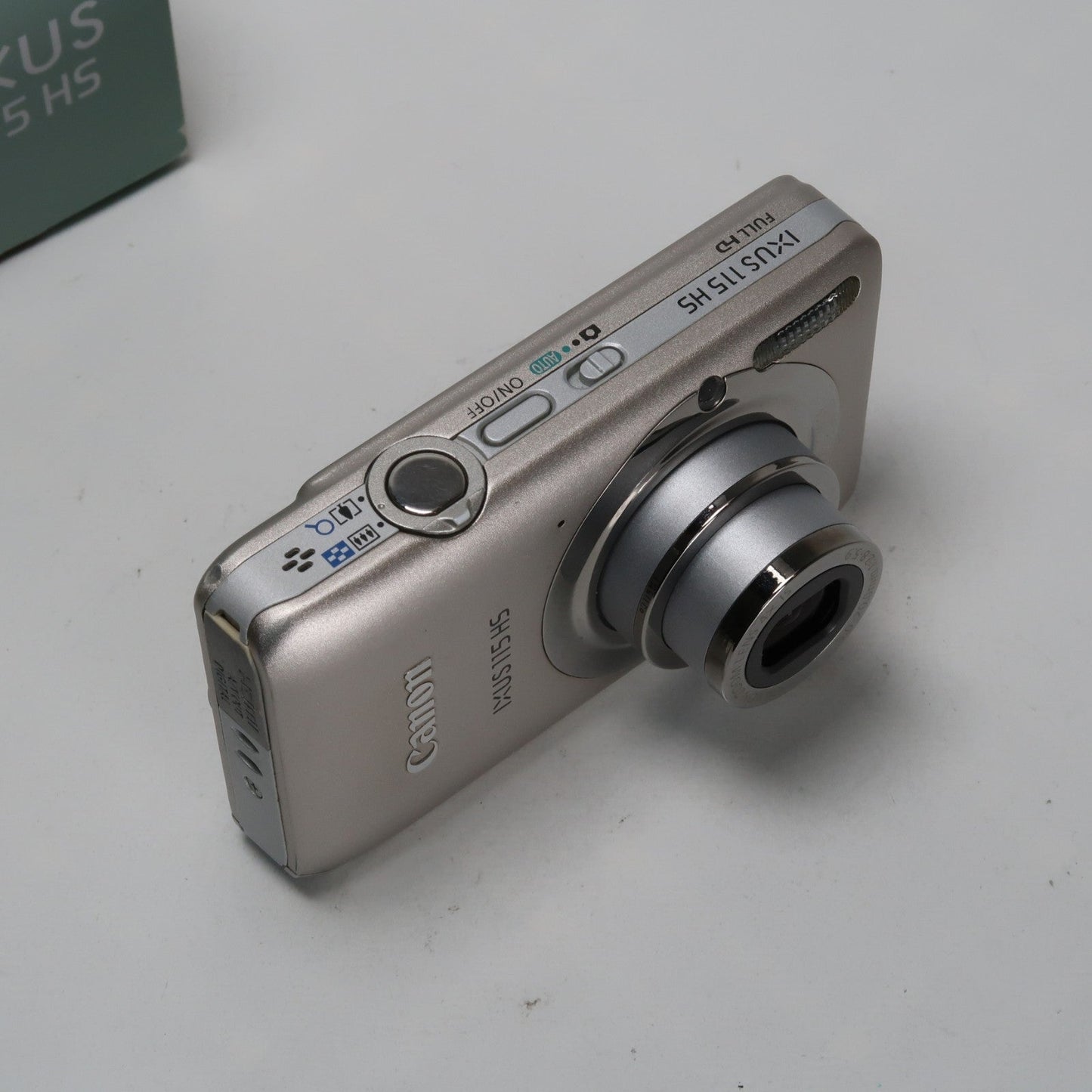 Pre-owned Canon IXUS 115 HS PowerShot ELPH 100 HS 12.1MP 4x Digital Camera Silver – Very Good Condition