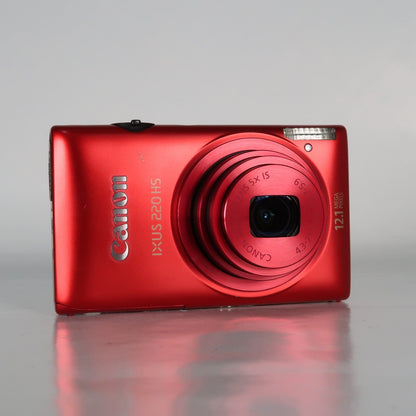 Pre-owned Canon IXUS 220 HS 12.1MP Digital Camera Red – Boxed Set