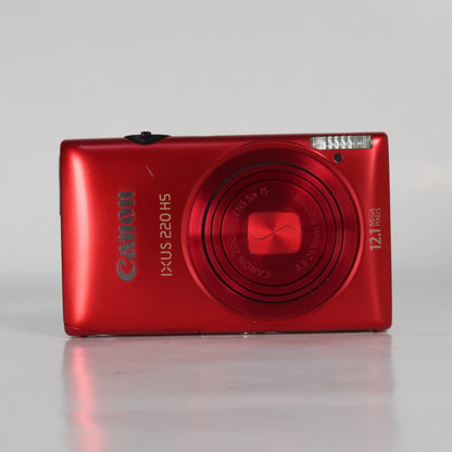 Pre-owned Canon IXUS 220 HS 12.1MP Digital Camera Red – Boxed Set