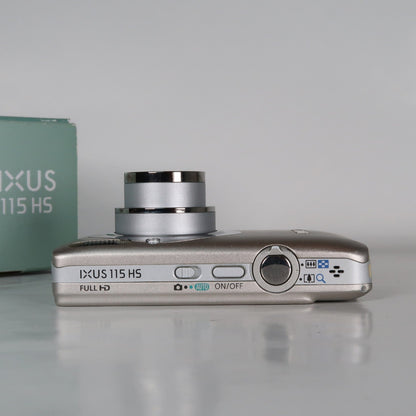 Pre-owned Canon IXUS 115 HS PowerShot ELPH 100 HS 12.1MP 4x Digital Camera Silver – Very Good Condition